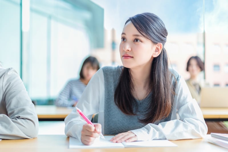 Girl studying hard (or hardly studying?)
