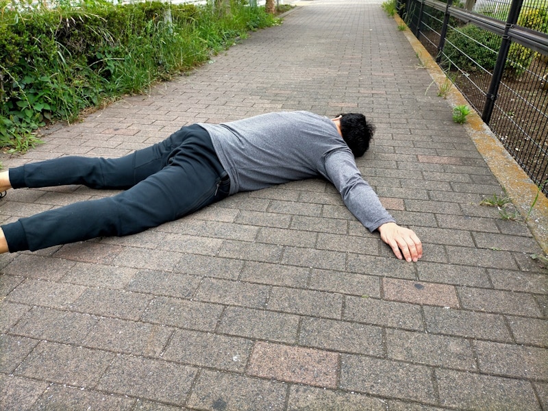 Man sleeping on sidewalk