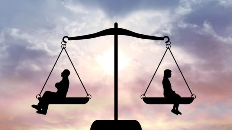 Man and woman in the balance of the law