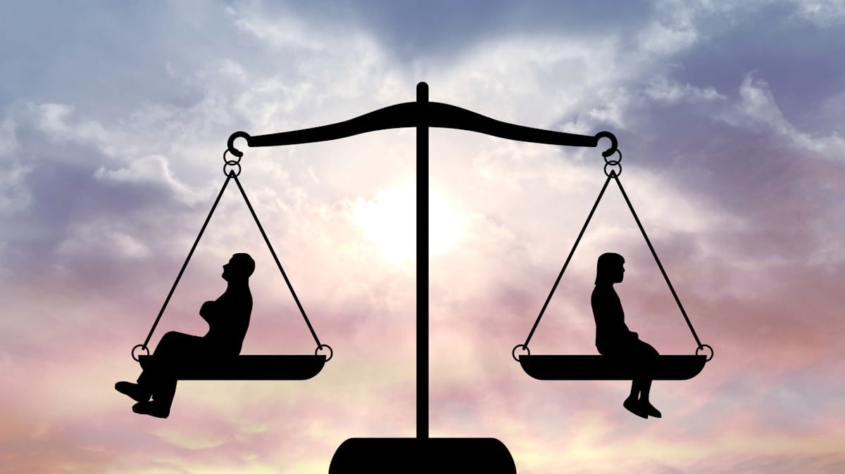 Man and woman in the balance of the law