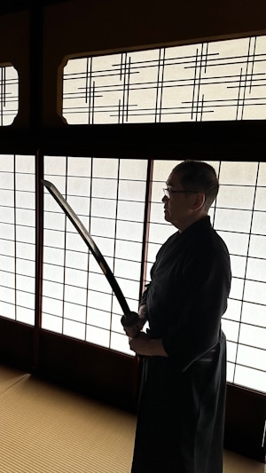 Teacher holding a sword