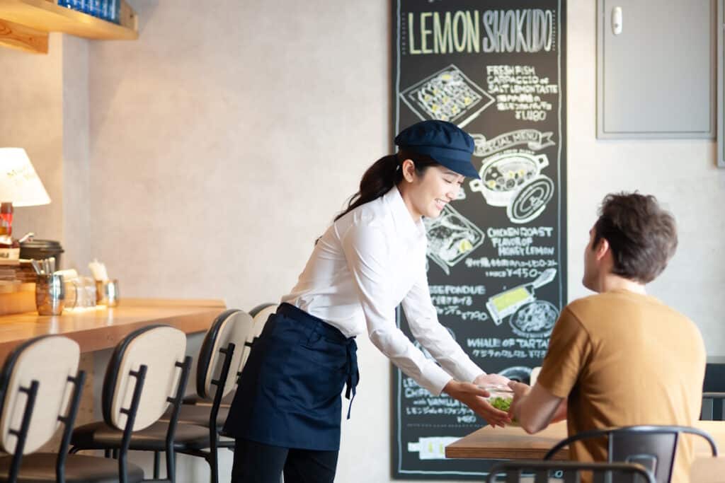 Japanese woman serving some white dude