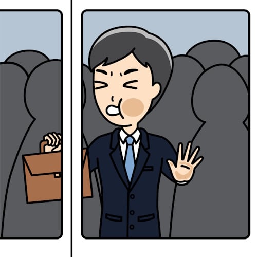 Man pushed up against glass doors on a crowded train