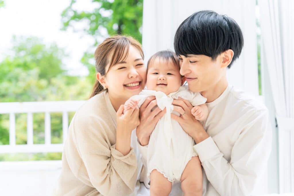 Mom and dad holding baby