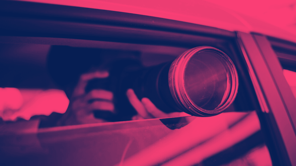 Man taking picture from car