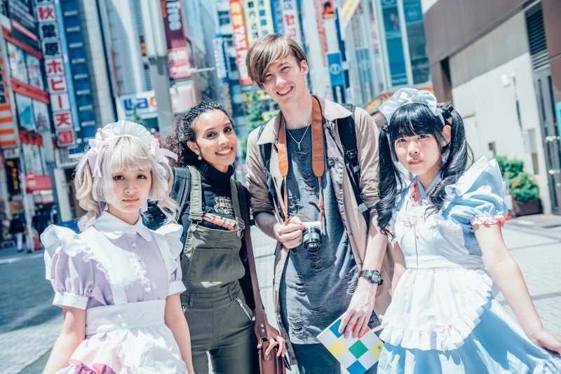 Akihabara - man and woman with maids