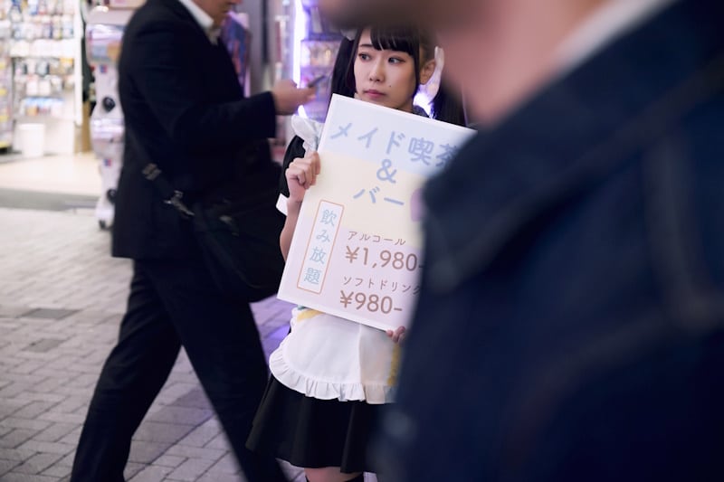 Maid doing legal advertising for her maid cafe