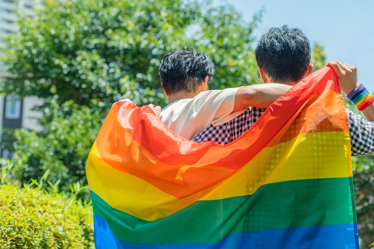Same sex couple with LGBTQ flag