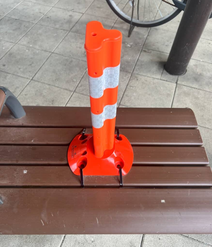 Traffic cone strapped to bench in Nakai