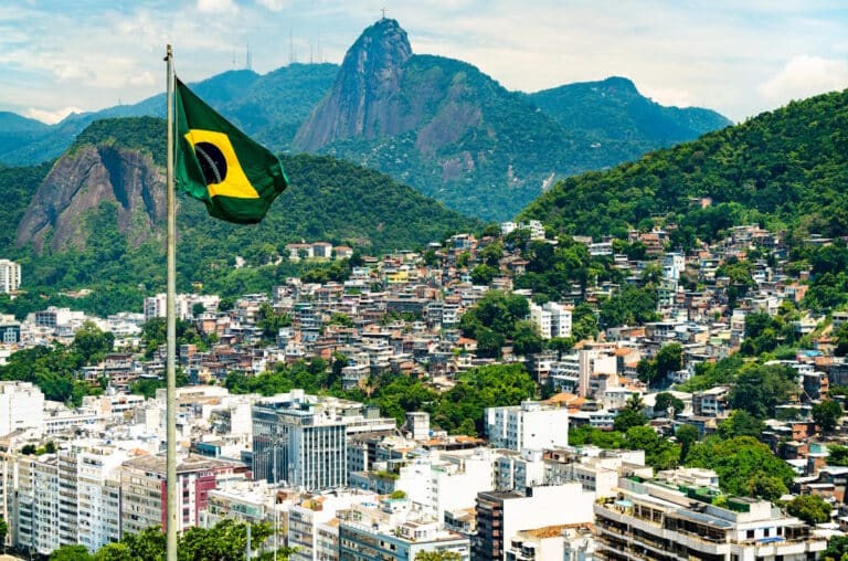 Flag of Brazil with Rio de Janeiro in the background