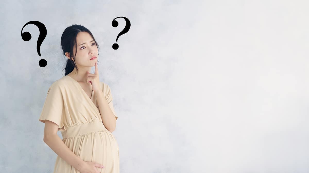 Woman questioning herself while pregnant