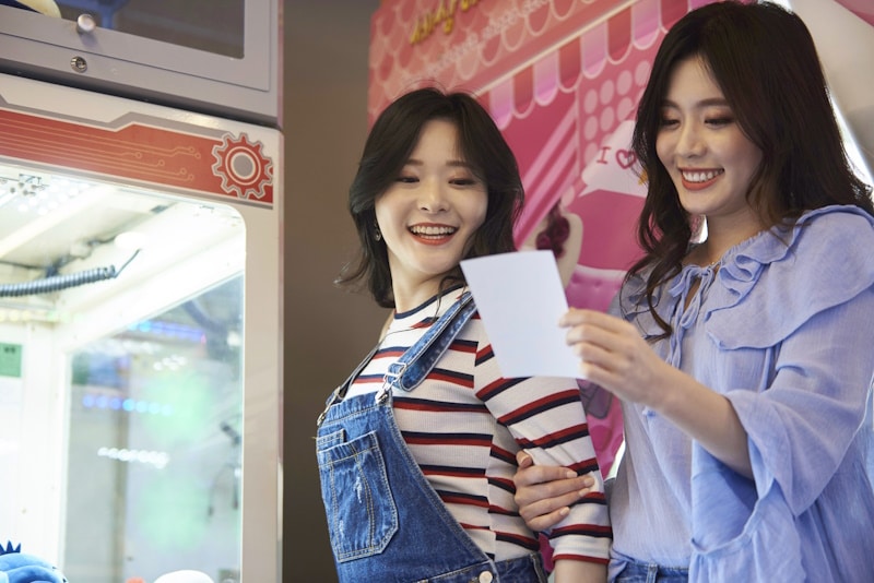 Women at a purikura photo booth
