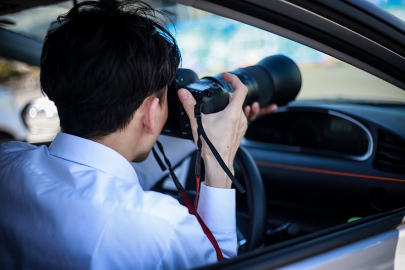 Man taking peeping tom photography