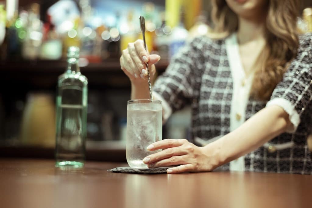 Woman serving drinks at a snack bar
