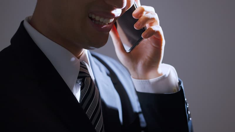 Man sweet-talking someone on the phone