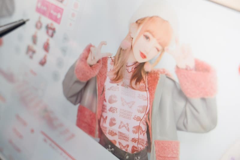 Woman editing a photo at a purikura booth