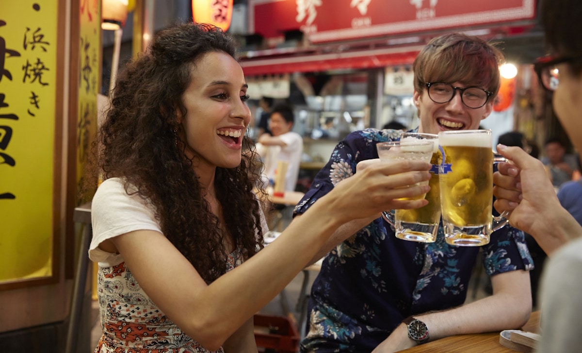 Tourists in Japan drinking beer, which doesn't exist in other countries