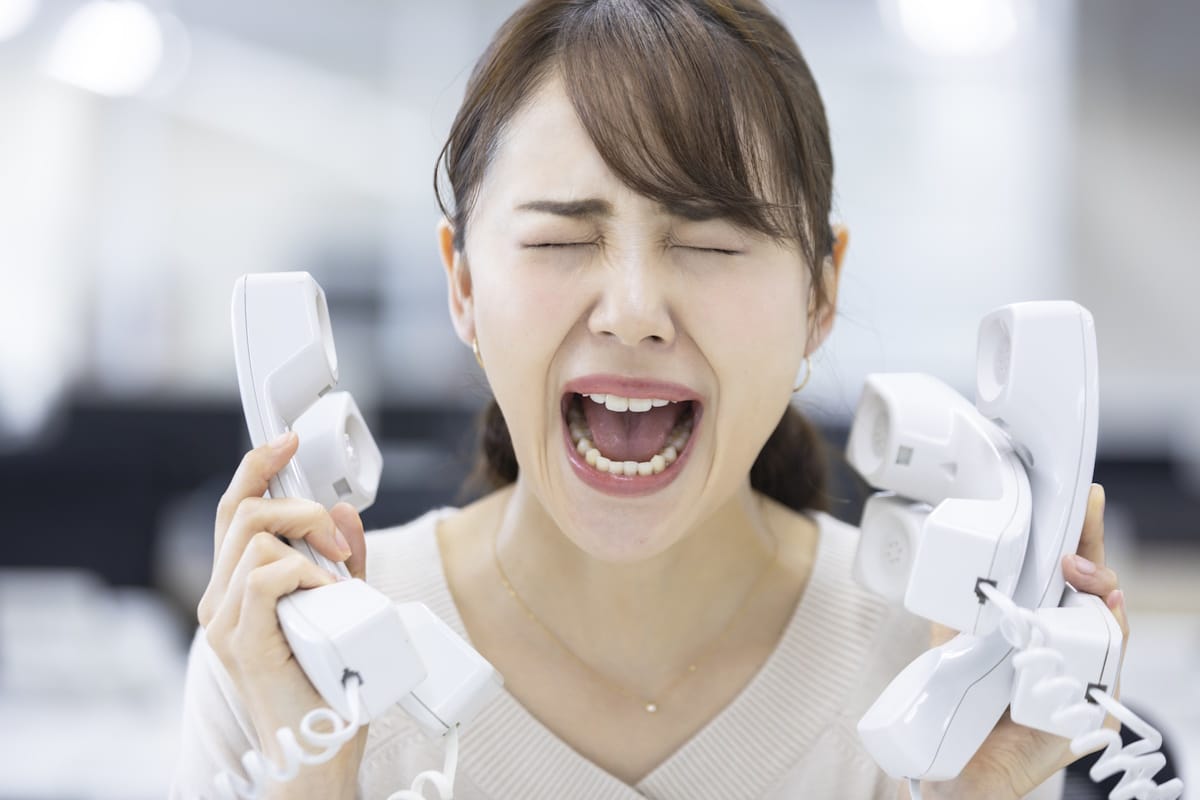 Woman being harassed by what appears to be an AI-generated level of phones