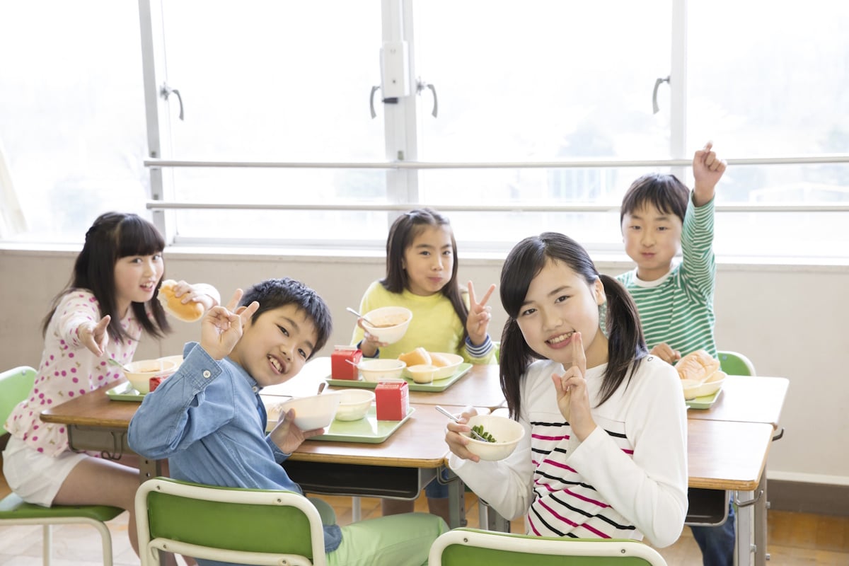 Kids having school lunches