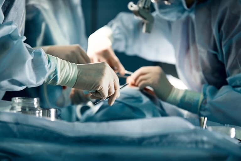 Surgeons operating on a patient