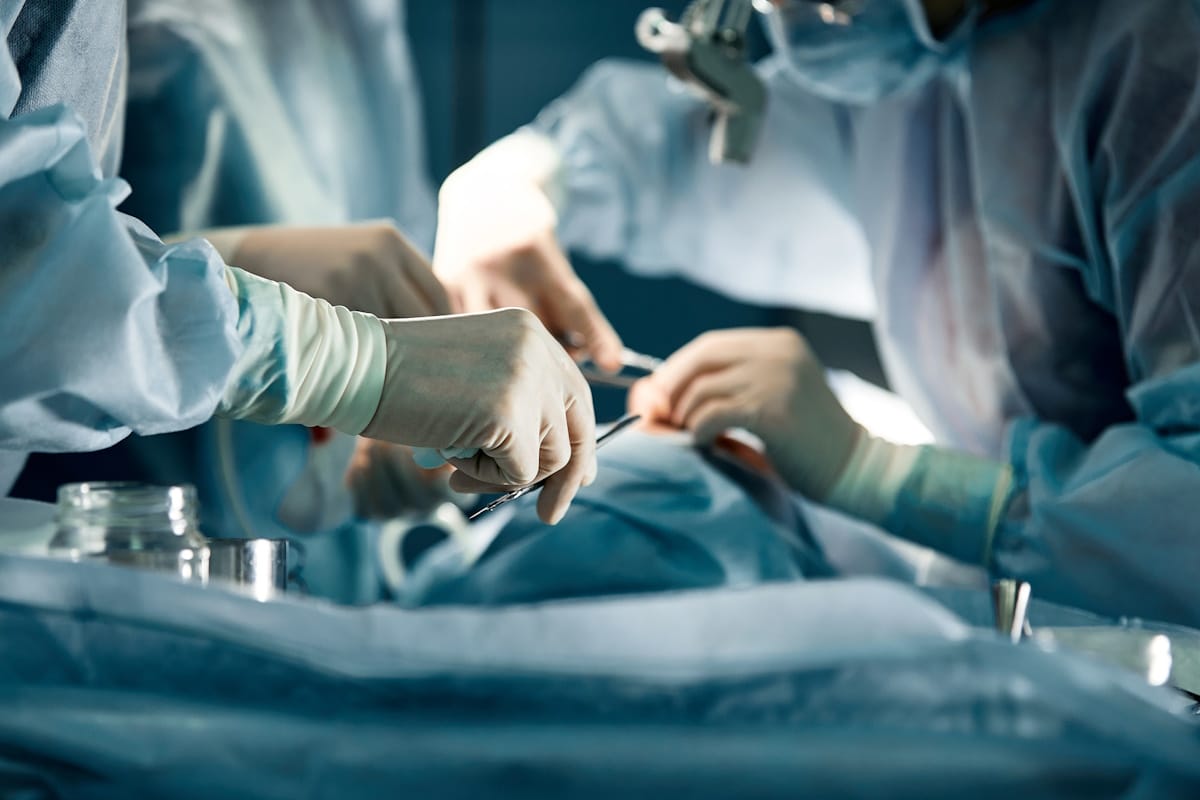 Surgeons operating on a patient