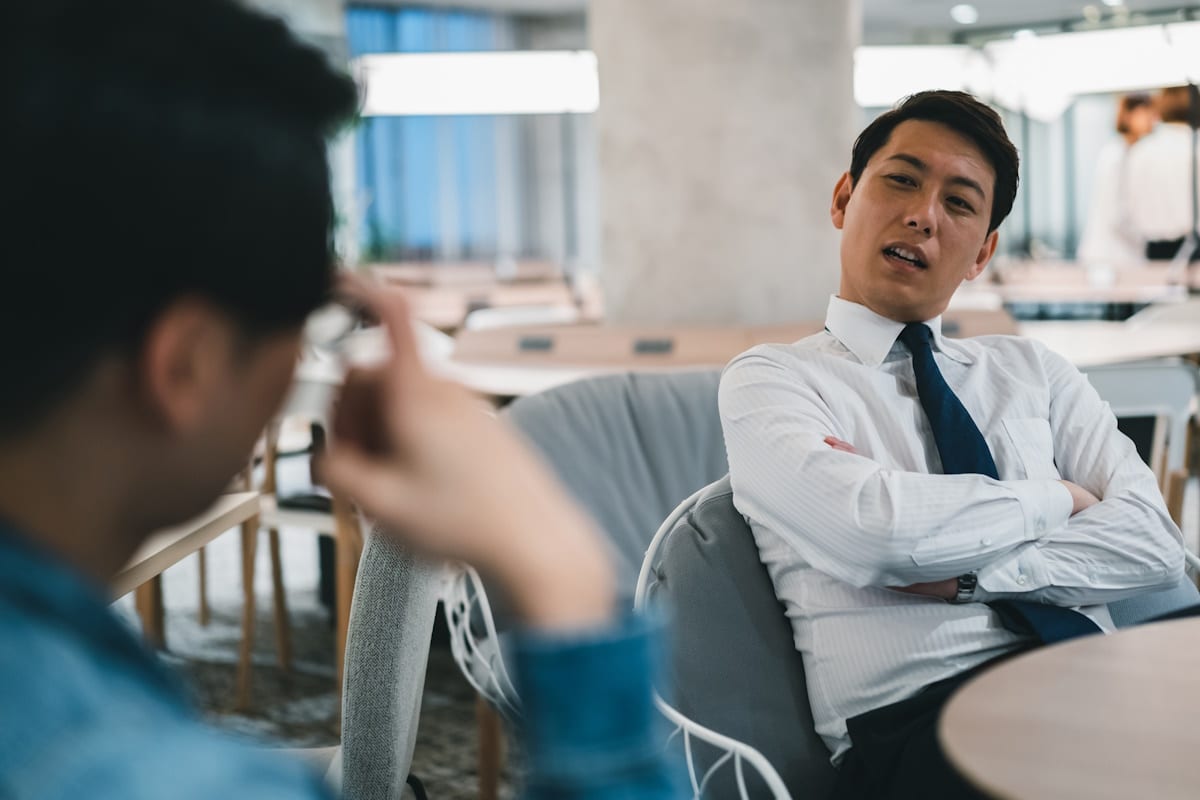 Businessman looking at another worker like he's an idiot