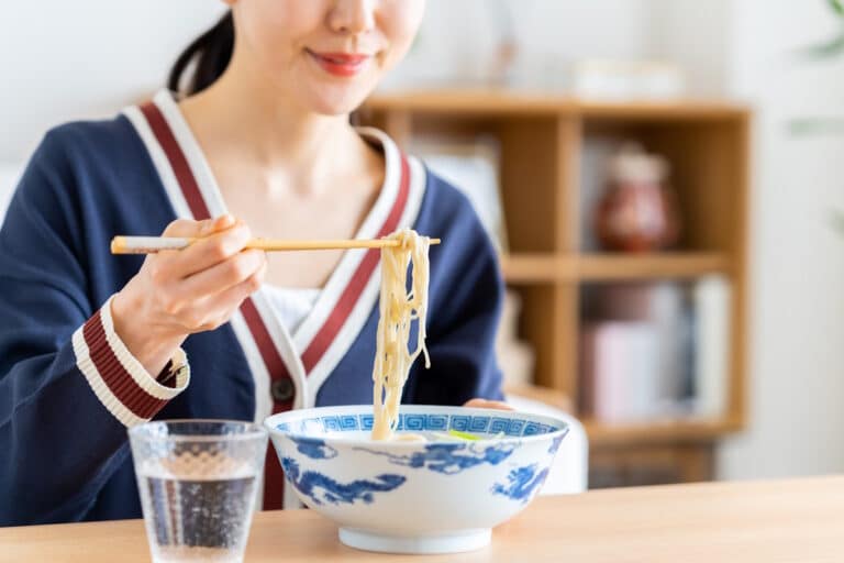 Woman eating ramen