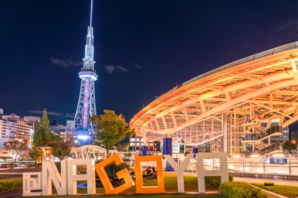Picture of Oasis21 in Nagoya, with an "@NAGOYA" sign monument in the foreground