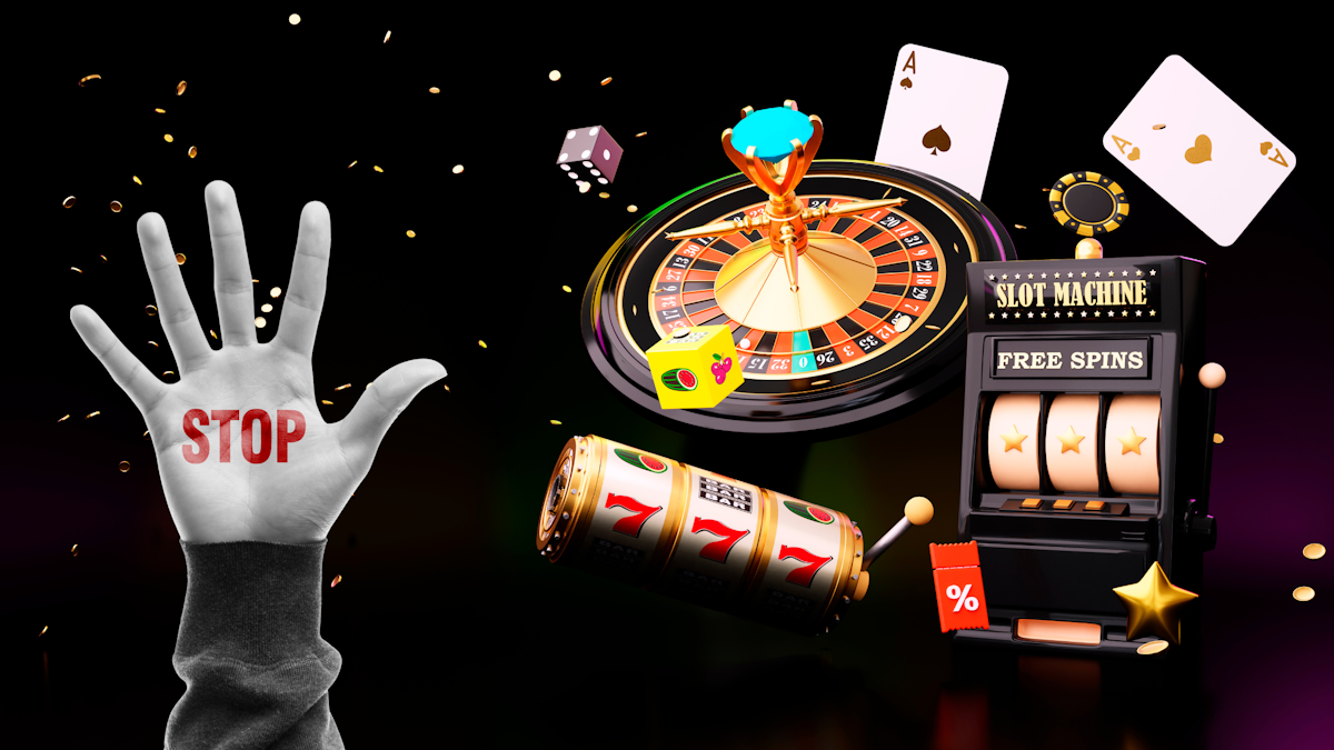 Online casino blocking - picture of a hand on the left with the word "stop" written on it. To the right, various symbols of glambling, including a slot machine, cards, and a roulette wheel