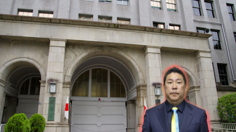 Tachibana Takashi looking at camera, picture imposed in front of the Ministry of Finance building