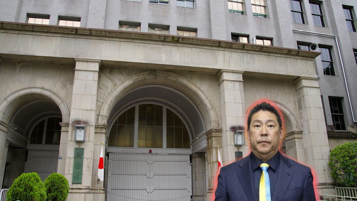 Tachibana Takashi looking at camera, picture imposed in front of the Ministry of Finance building