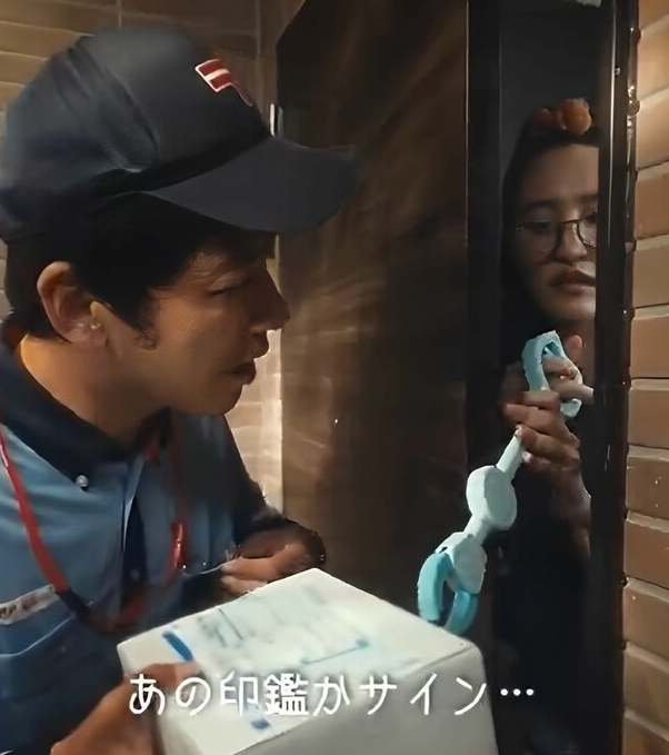 Women attempts to sign for the package using a grabber tool