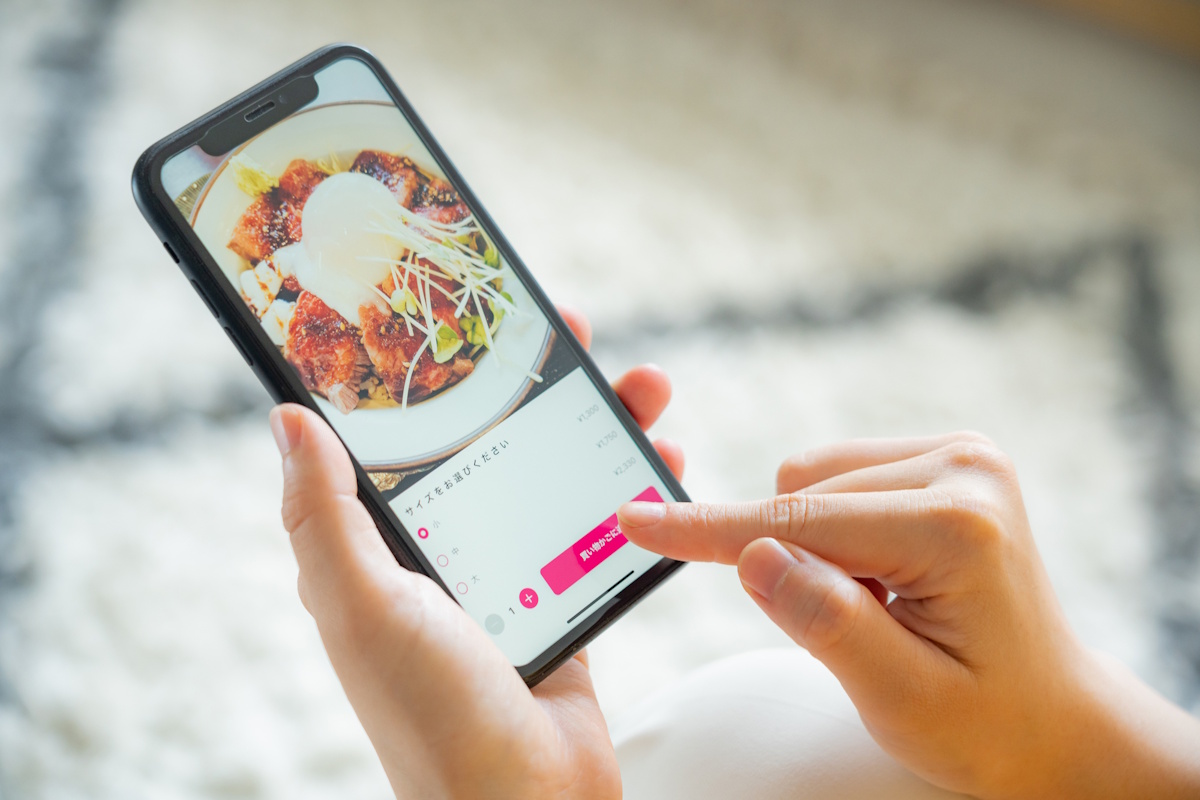 Woman ordering food from her smartphone