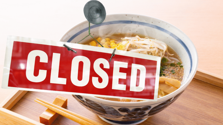 A bowl of ramen with a Closed sign superimposed over it