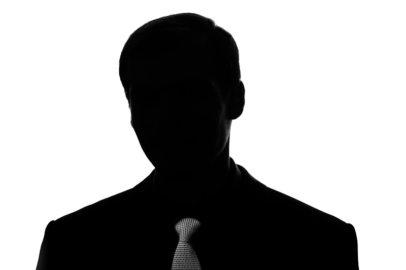 Portrait young man in suit, tie in front view - silhouette