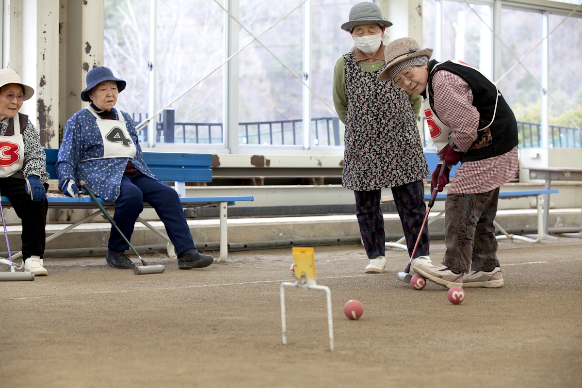 Senior citizens playing gateball