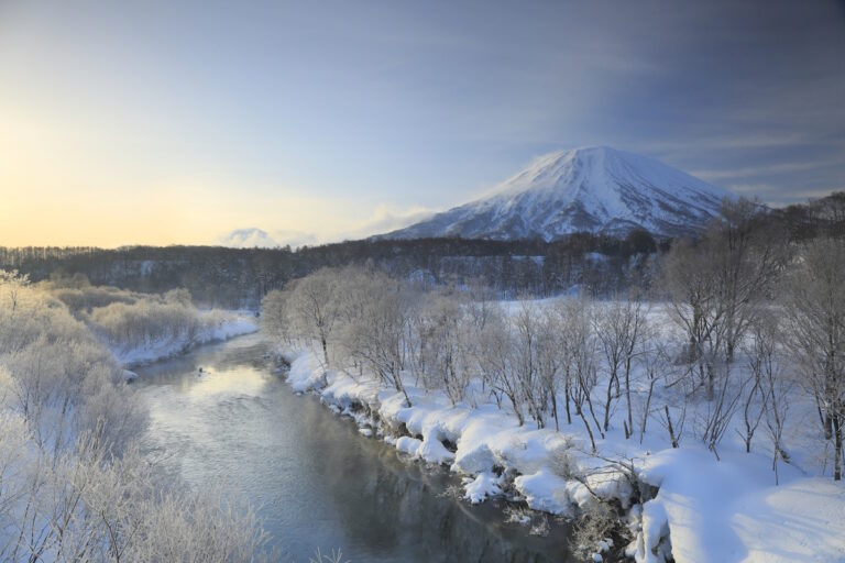 Yōtei in Hokkaido seen from a distance with a river in the foreground