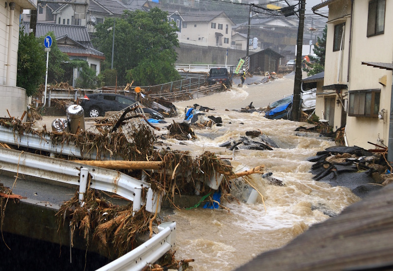 Floodwaters roar through a Japanese town