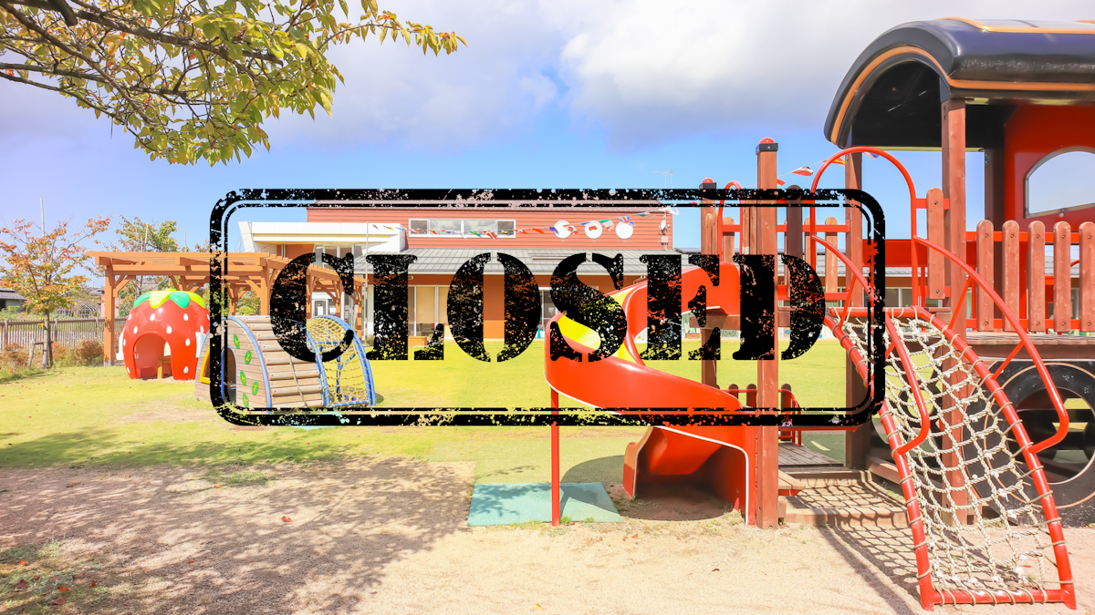 A playground with a Closed sign displayed on top of it