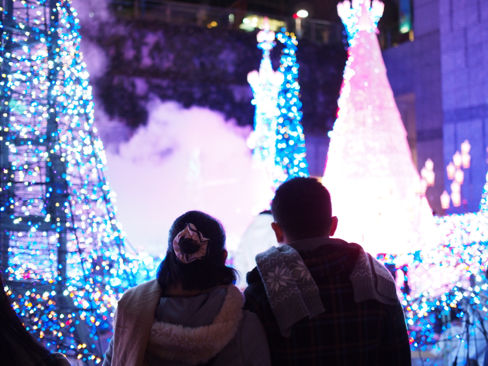 A couple looking at Christmas lights together