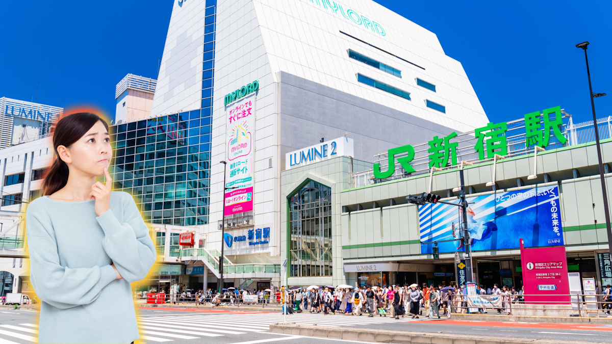 Woman looking perplexed at Shinjuku Station
