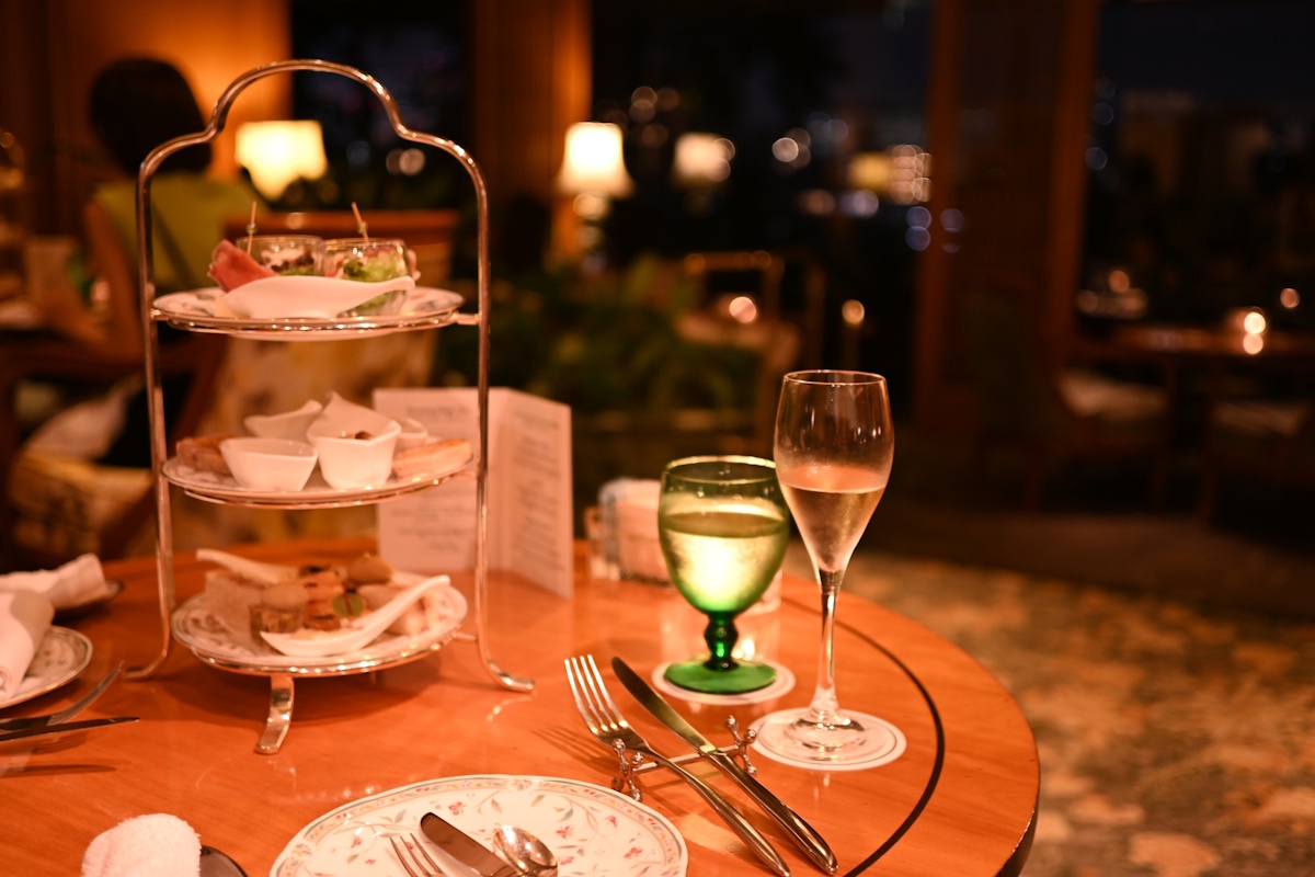 Fancy restaurant/cafe with two wine glasses on the table. Very adult, quiet atmosphere