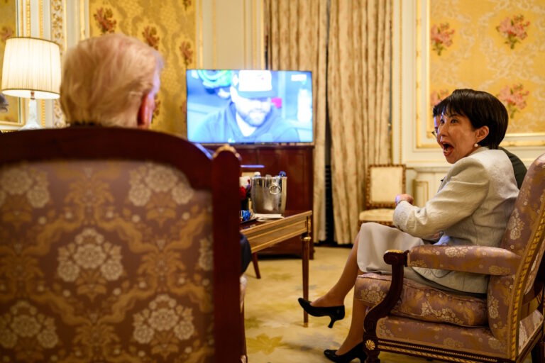 Takaichi Sanae with an expression of shock on her face looking at US President Donald Trump