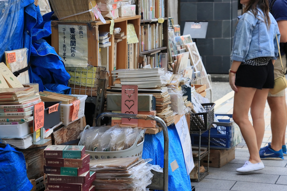 Piles of magazines and zines available for sale in Jimbocho