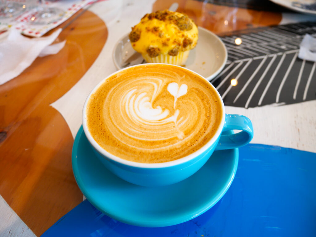 A latte and a lemon crumb muffin at bar anohito.
