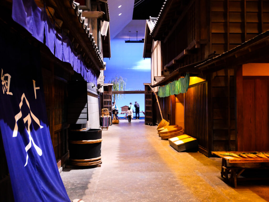 Recreated Edo-era street of wooden shops and indigo shop curtains inside the Fukagawa Edo Museum