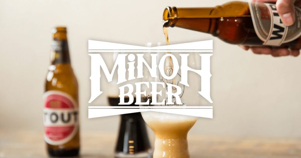 Minoh Beer bottles being poured into a glass with the brewery's logo overlaid