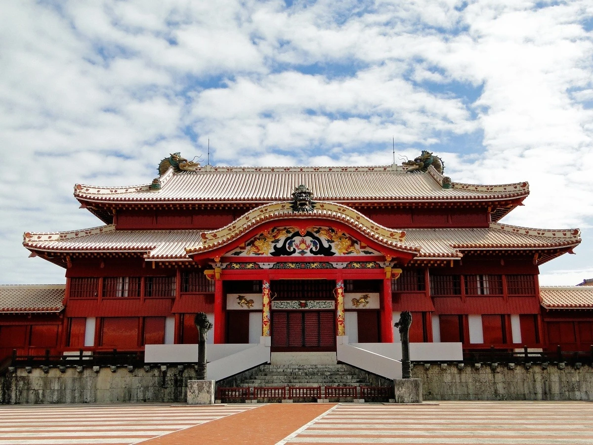Shuri Castle, the former seat of the Ryukyu Kingdom, under a cloudy sky