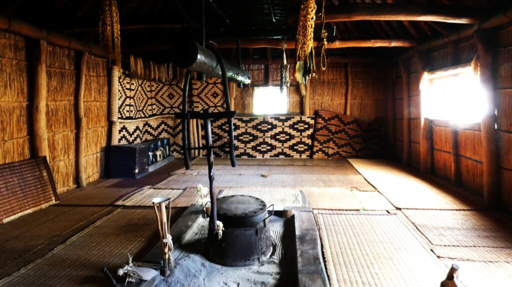 The inside of a reconstructed Ainui village at Upopoy.