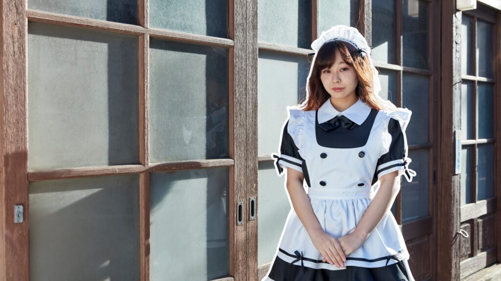 Woman in a frilly Akihabara-style maid cafe costume standing in front of wooden sliding doors